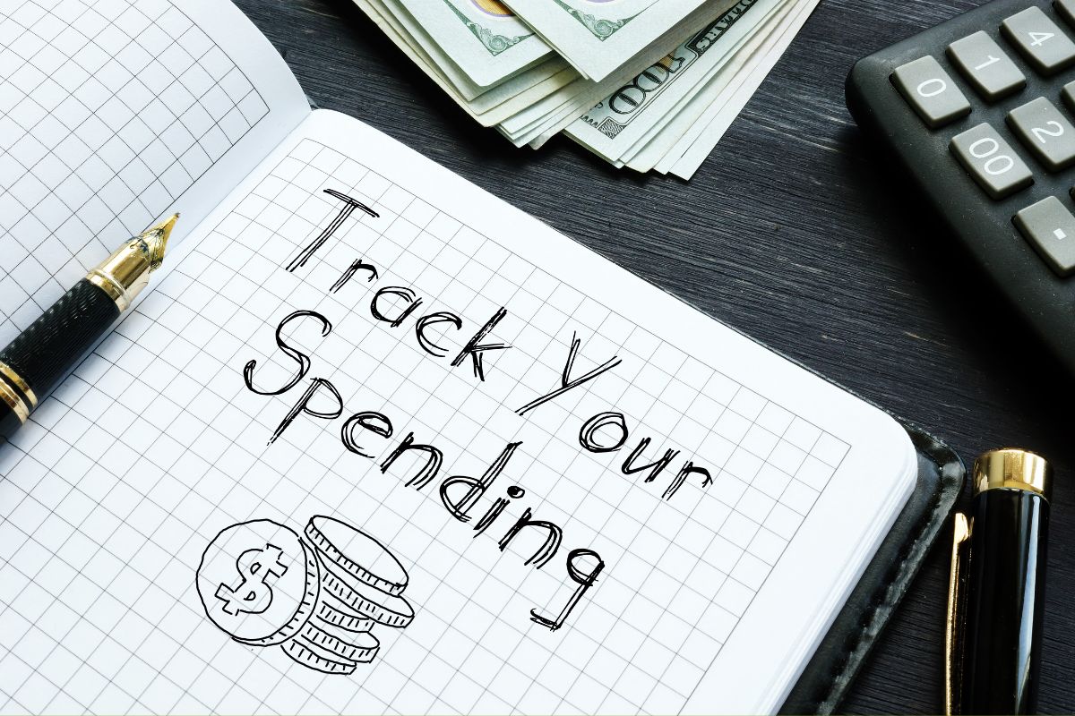 Image of a notebook with Track your spending wording.