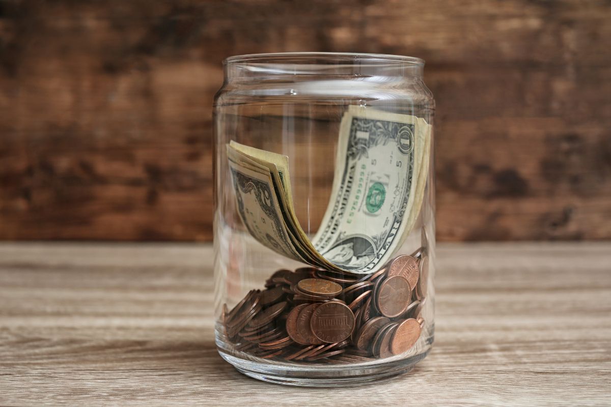 The image of a jar with money.