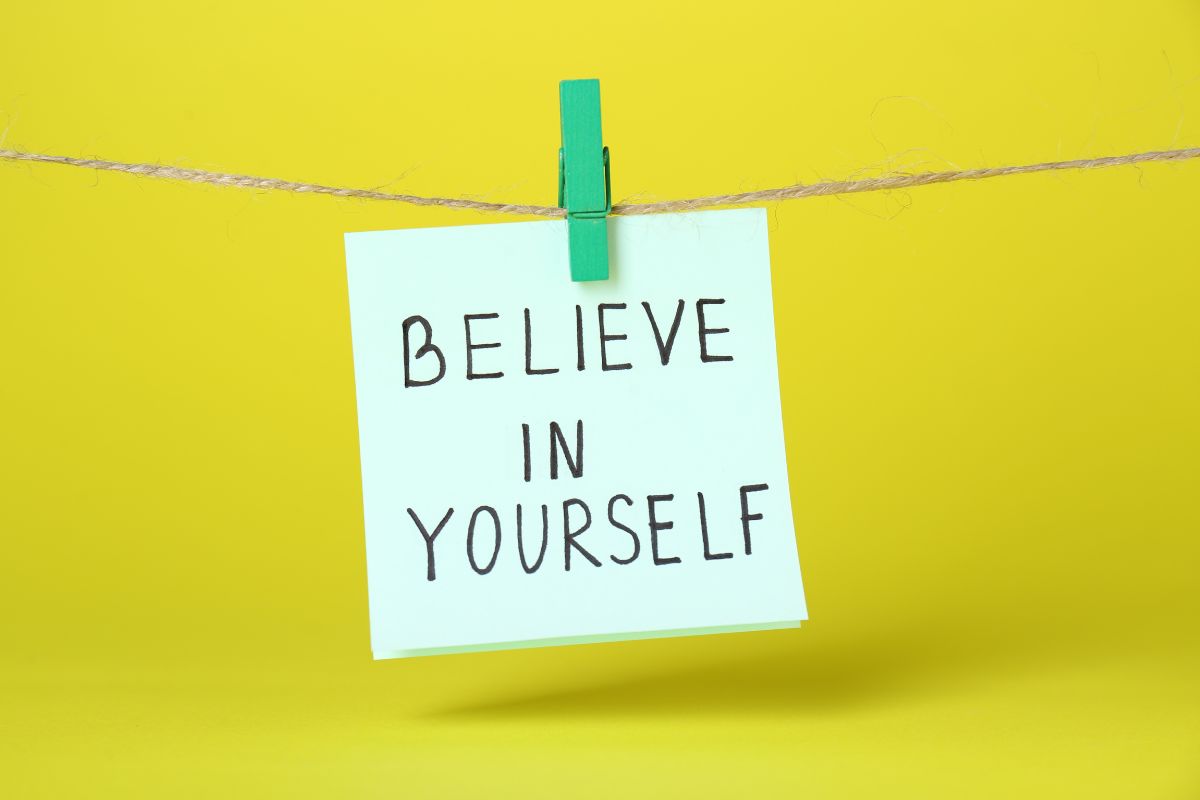 The image shows a piece of paper hung with a clip indicating to use of affirmations to stay focused to help remove doubts and keep you on track.