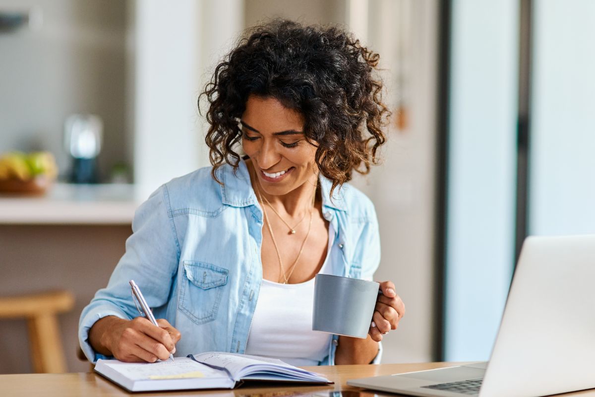 The image of a woman writing down her career wins.
