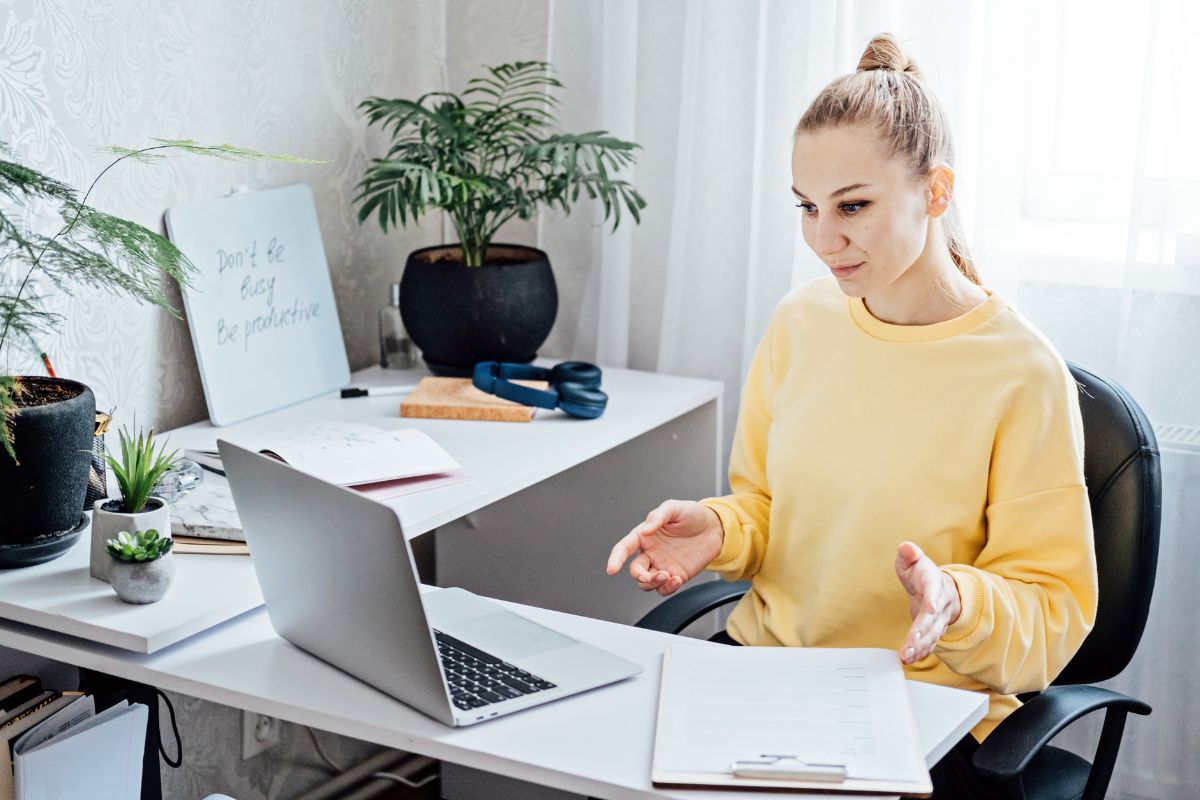 The photo of a woman working on her side hustle.
