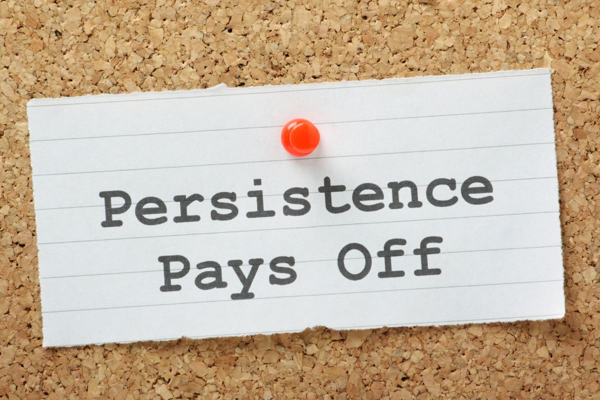 Thee picture of a paper with persistence pays off wording.