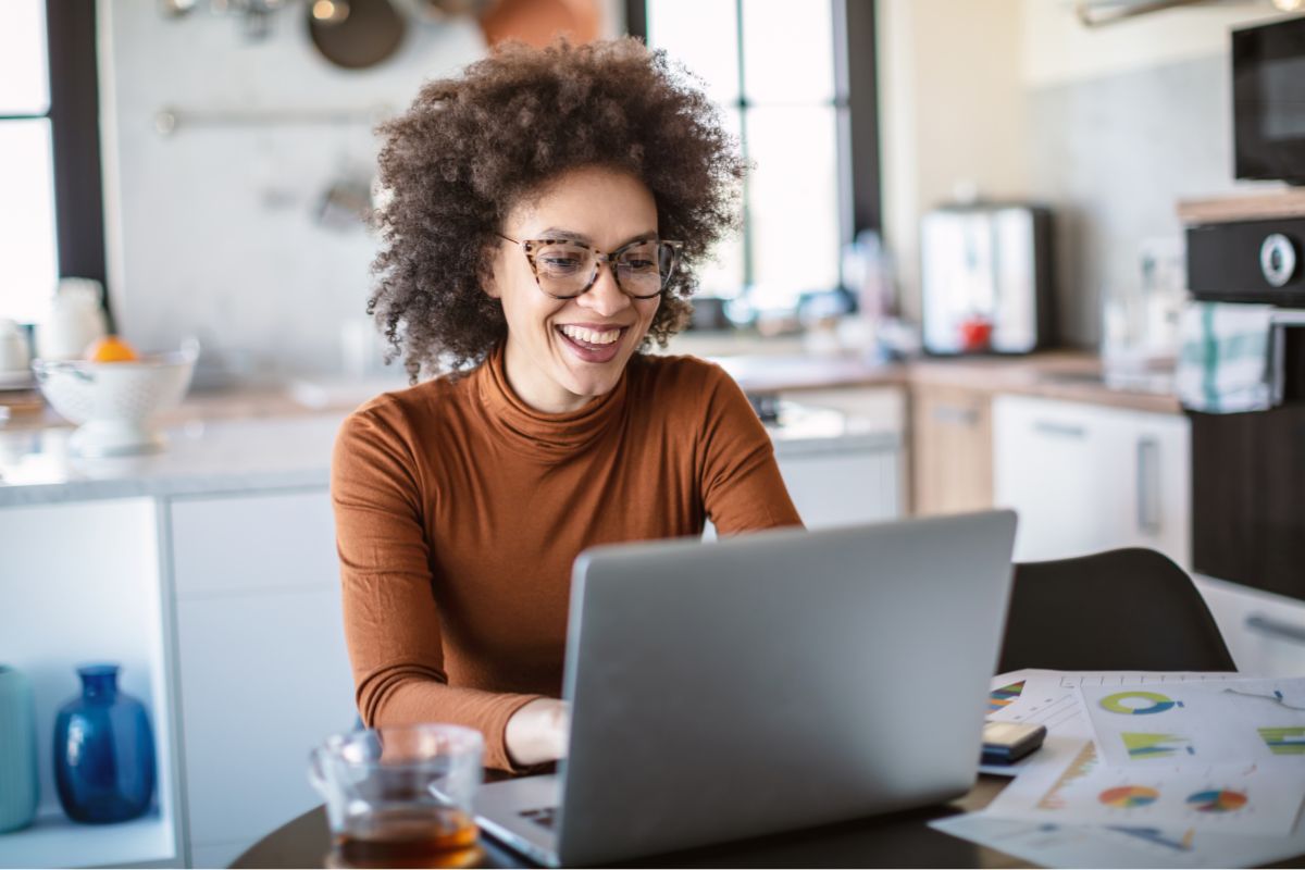 Image of a woman working from home.