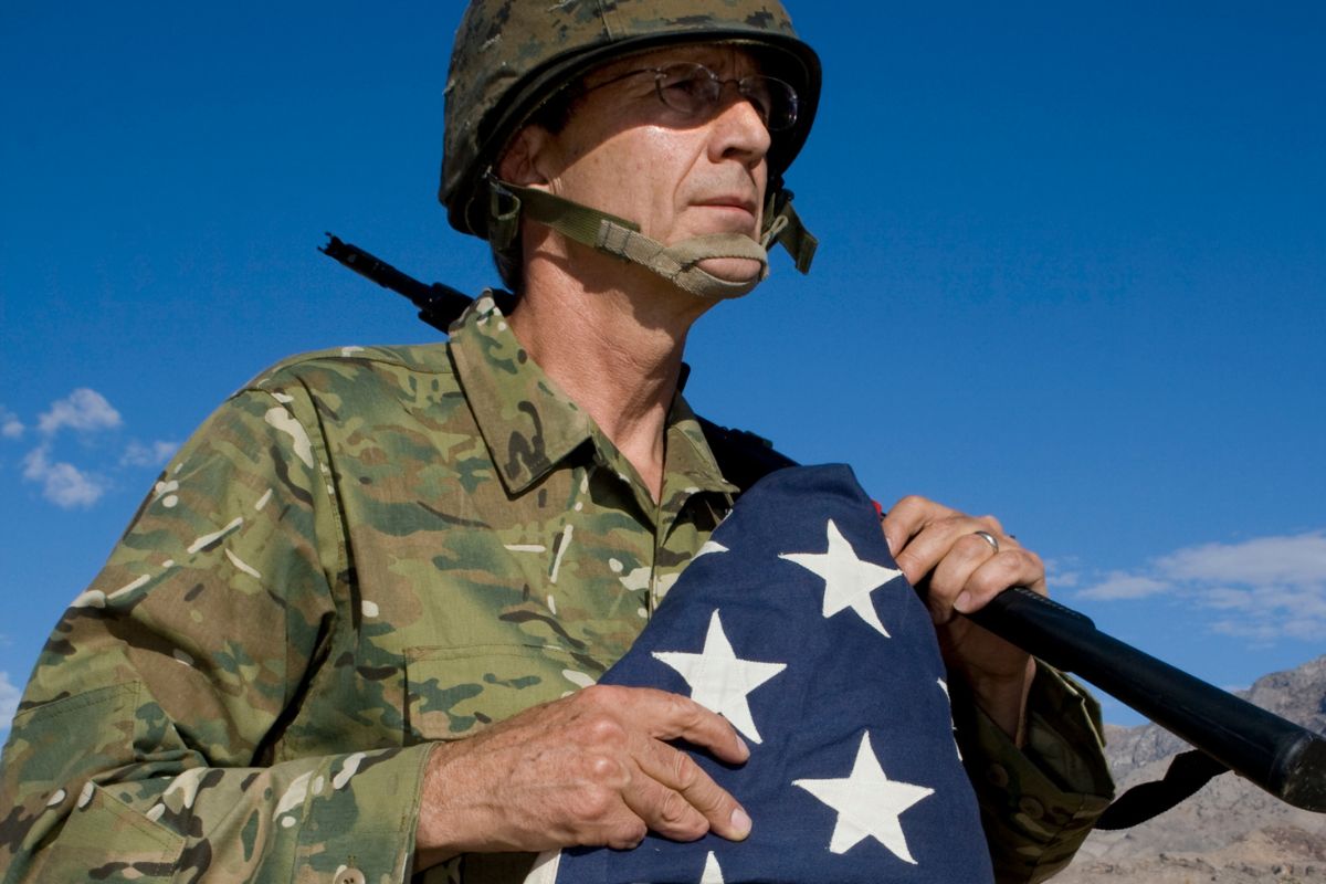 The image shows a man in military service.