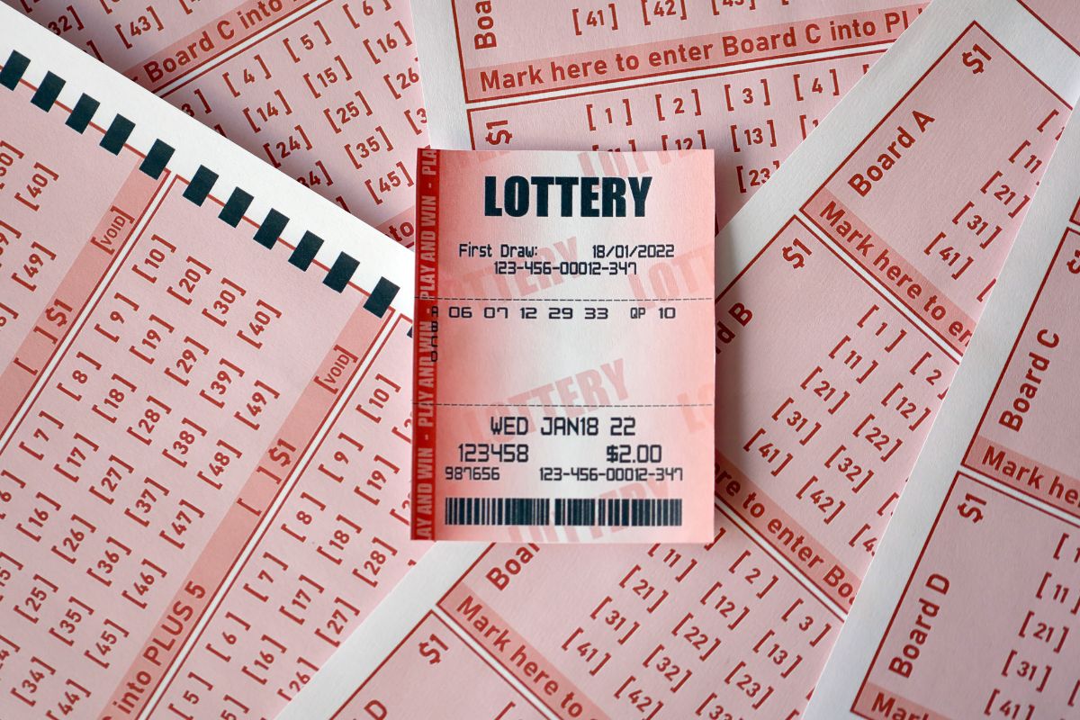 The photo shows papers with notes and numbers indicating that using cash for lottery tickets helps control spending and keeps you from gambling with money you don't have.