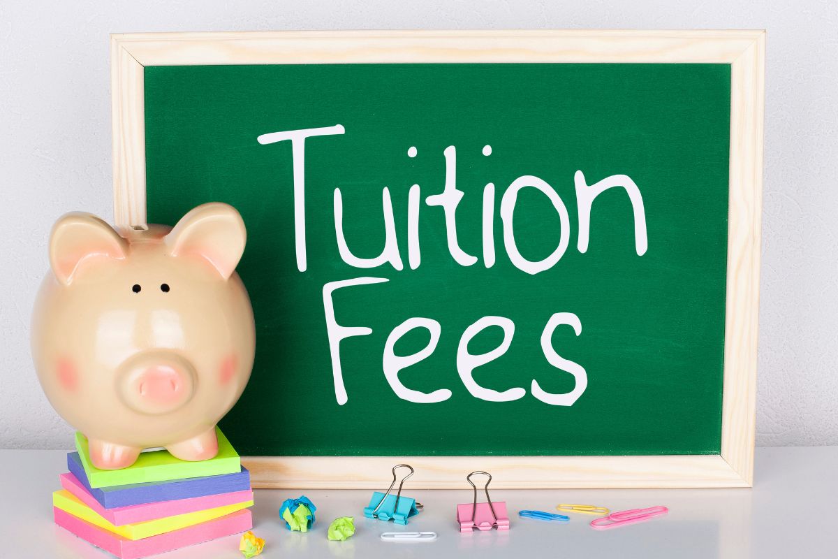 The photo shows a board with the tuition fees wording.