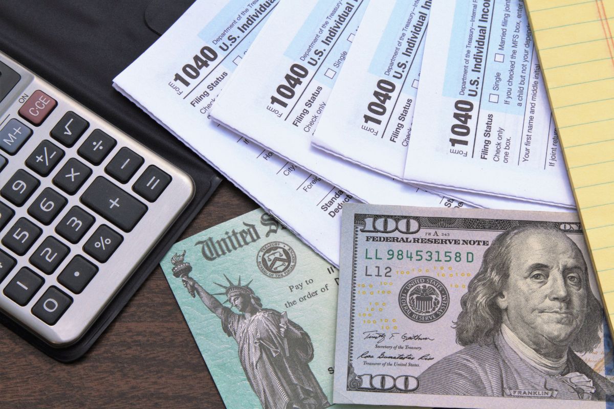 Photo of money and tax forms.