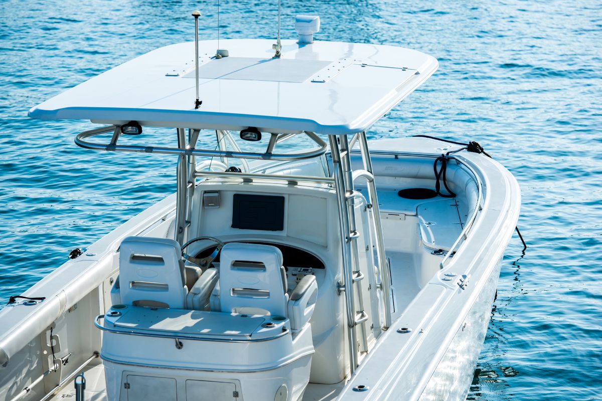 The image shows a boat in the sea referring to paying boats in cash saving thousands in interest and keeping you from overbuying.