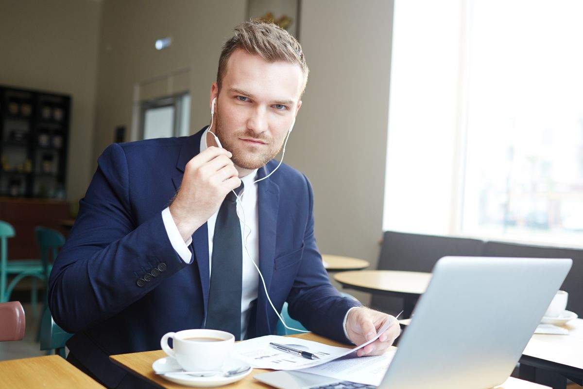 The photo shows a man doing an online business as a consultant.