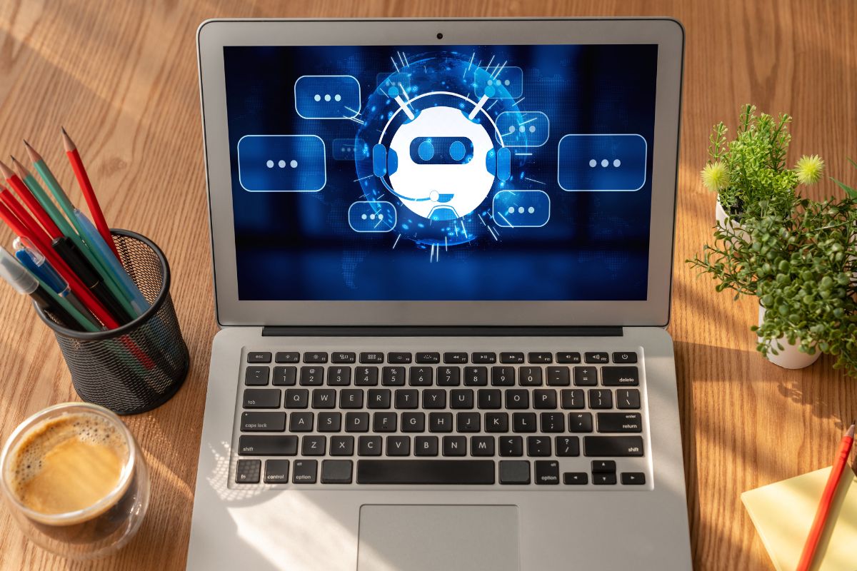 The photo shows a laptop with AI tools.