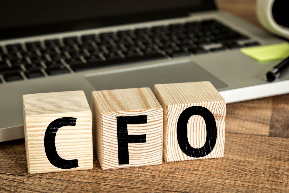The image shows a laptop and CFO wording.