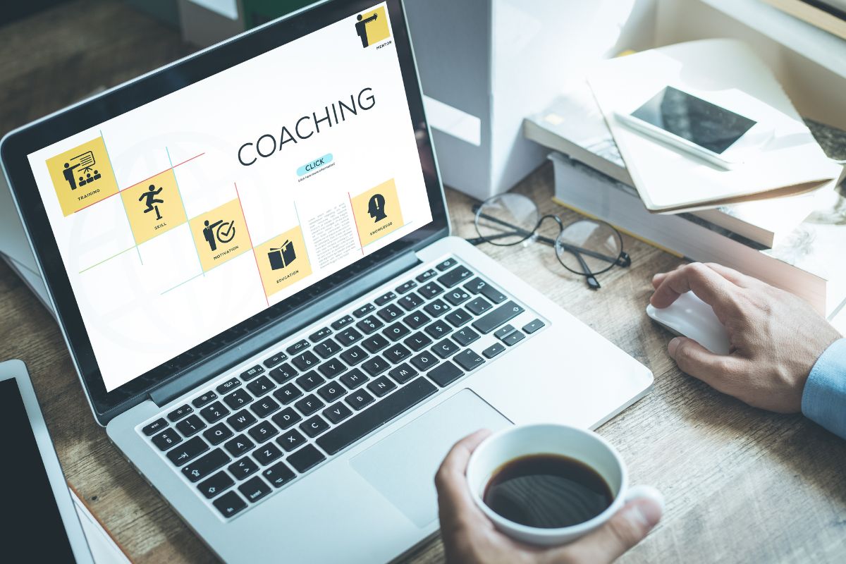 Image of a man's hand coaching online.