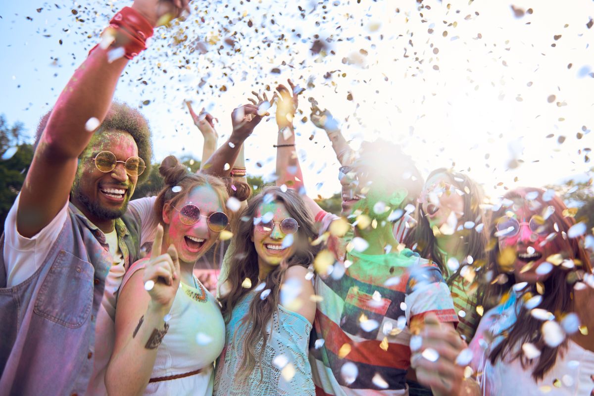 The image shows a group of people enjoying a free concert.