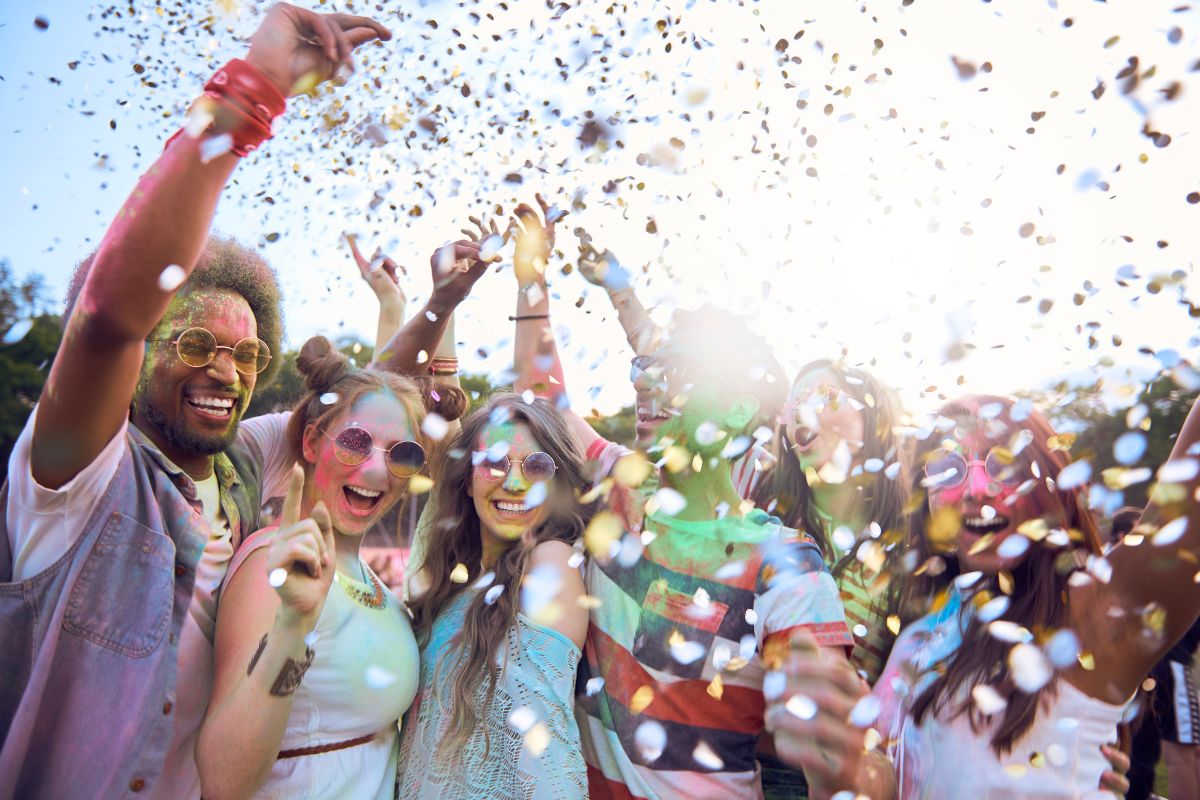 The image shows a group of people enjoying the vibes together at the open field which means that finding free versions of your favorite activities lets you keep enjoying what you love while saving money in your pocket.