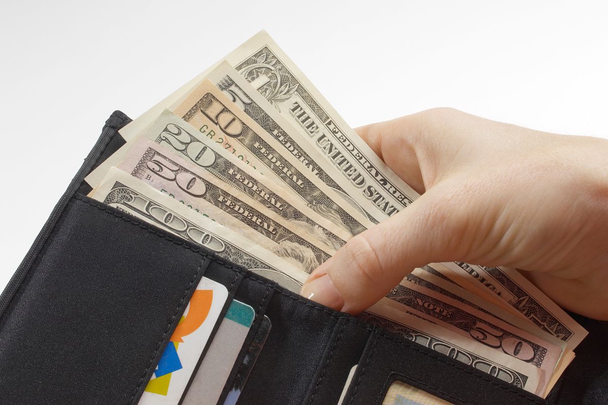 The image shows a woman doing a spending detox.