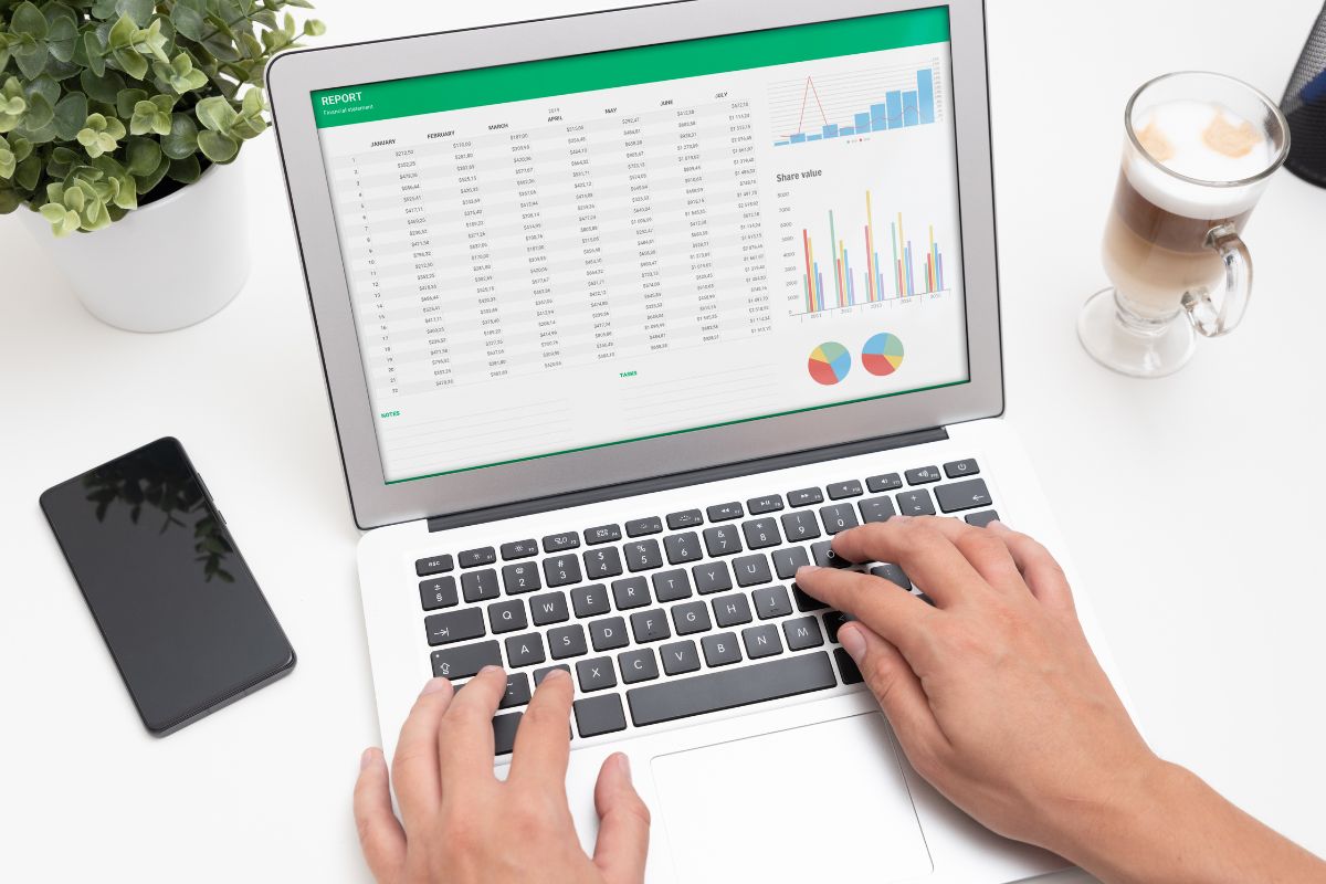 Image of a man's hand creating a visual debt tracker.