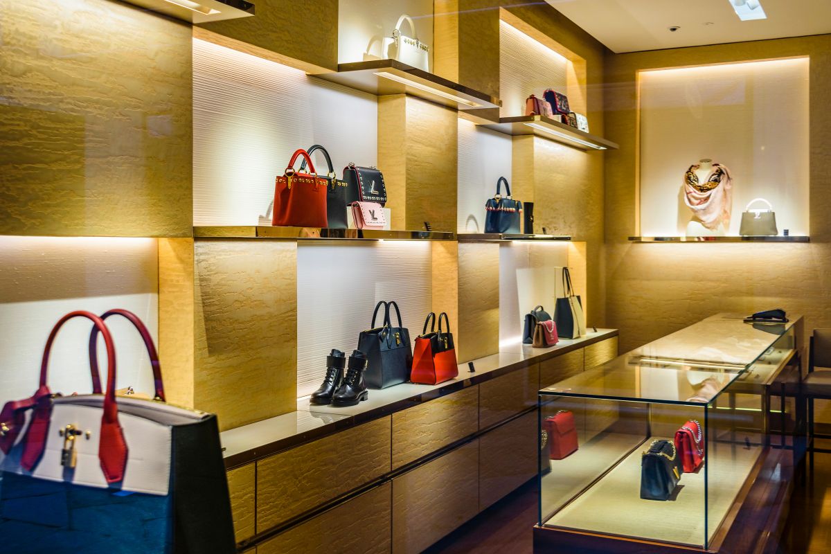 The picture tells about bags on the corner and shoes which refers to cutting one luxury but replacing something equally rewarding making the change easier.