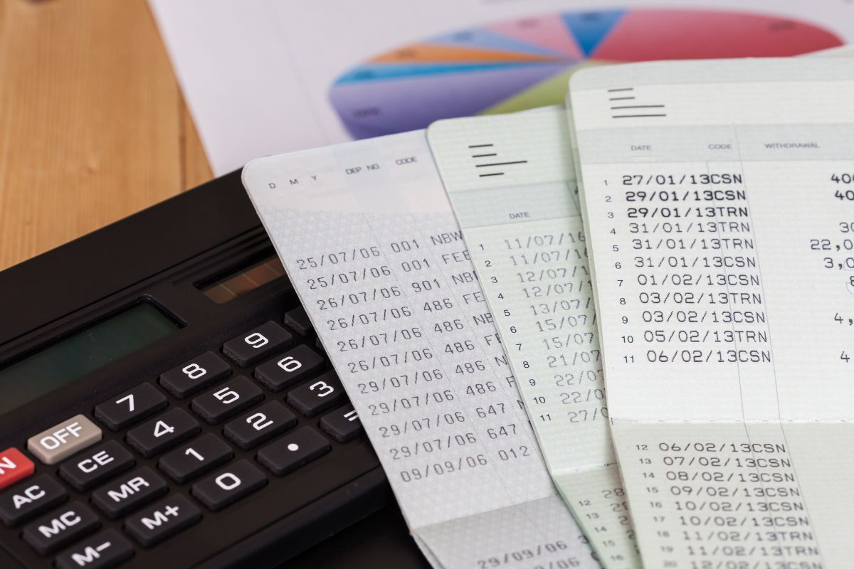 The image of a calculator and bank books.