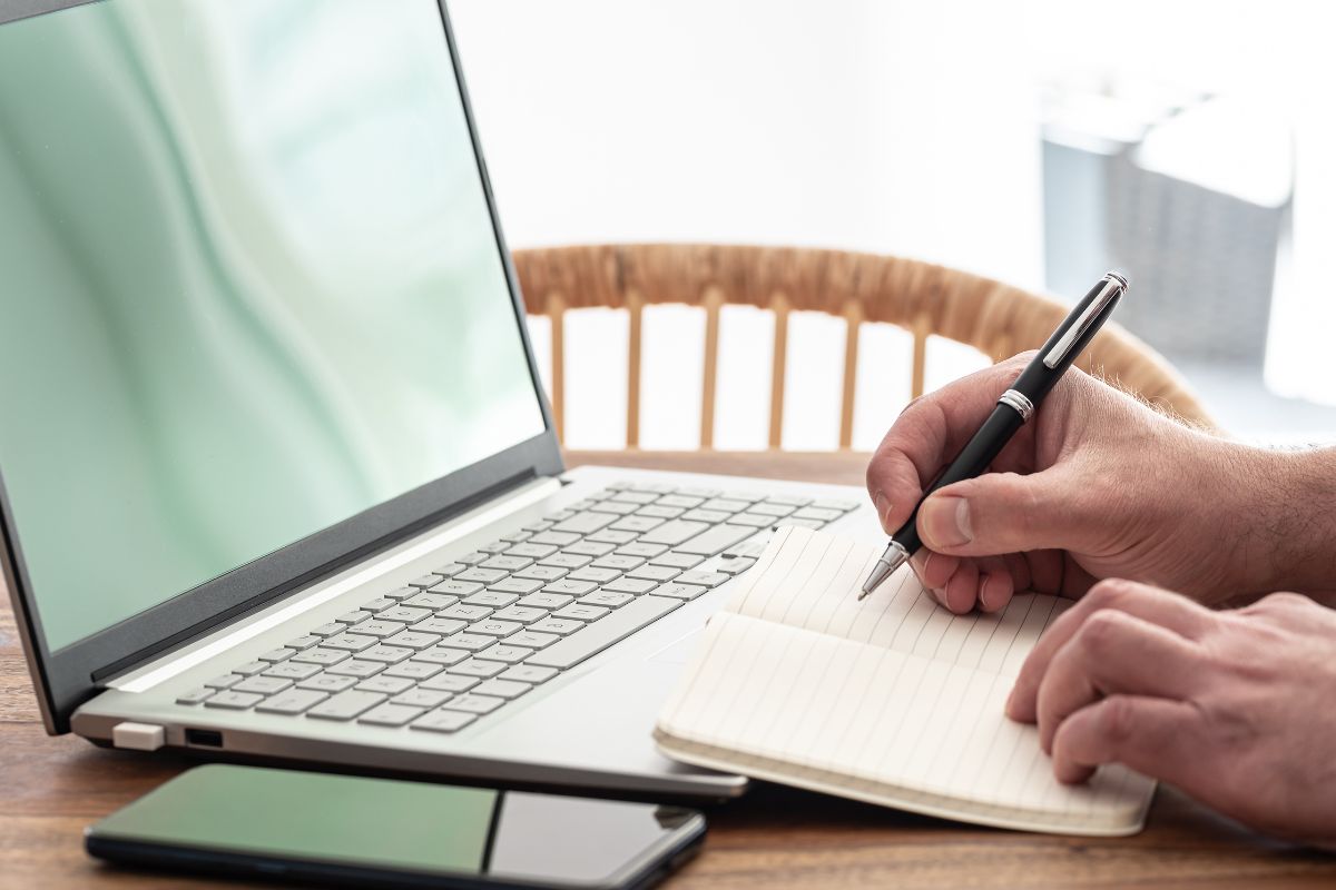The image shows a man learning online.