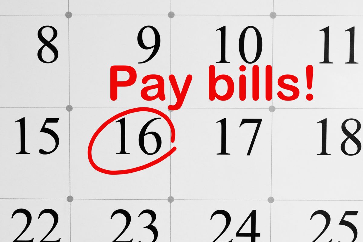 The picture shows a calendar with a pay bills note.
