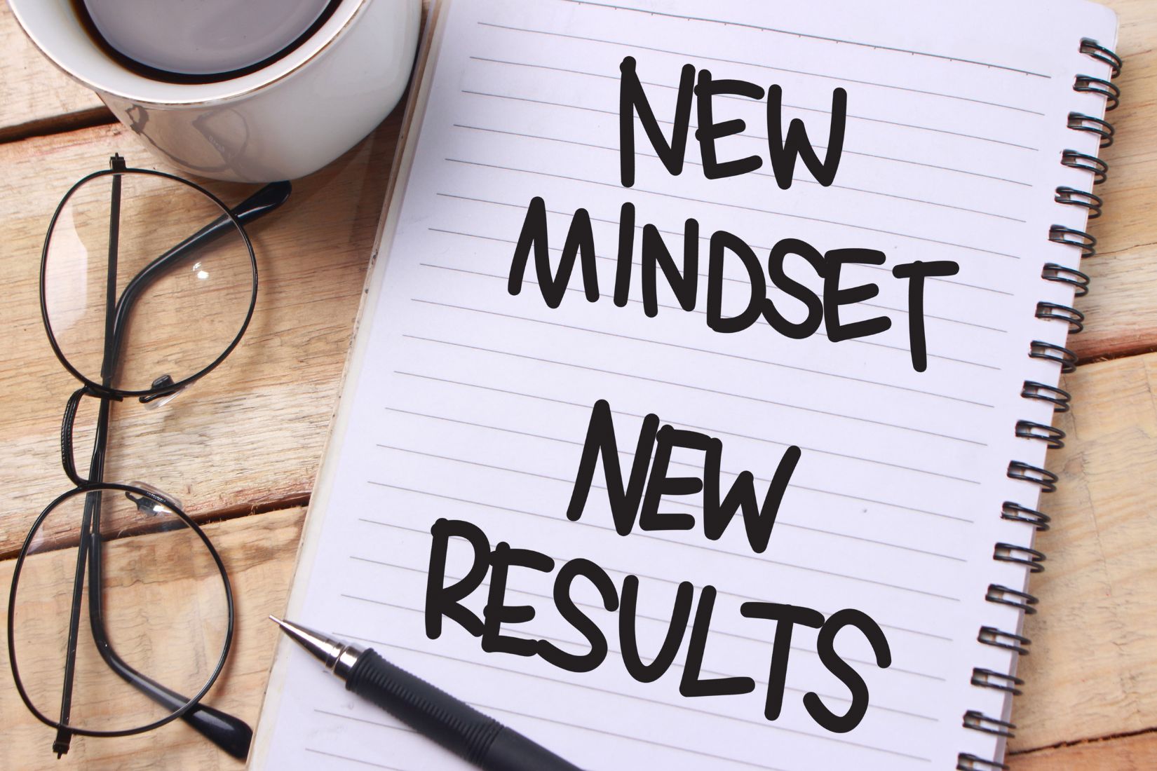 The image shows a notebook with notes about mindset.