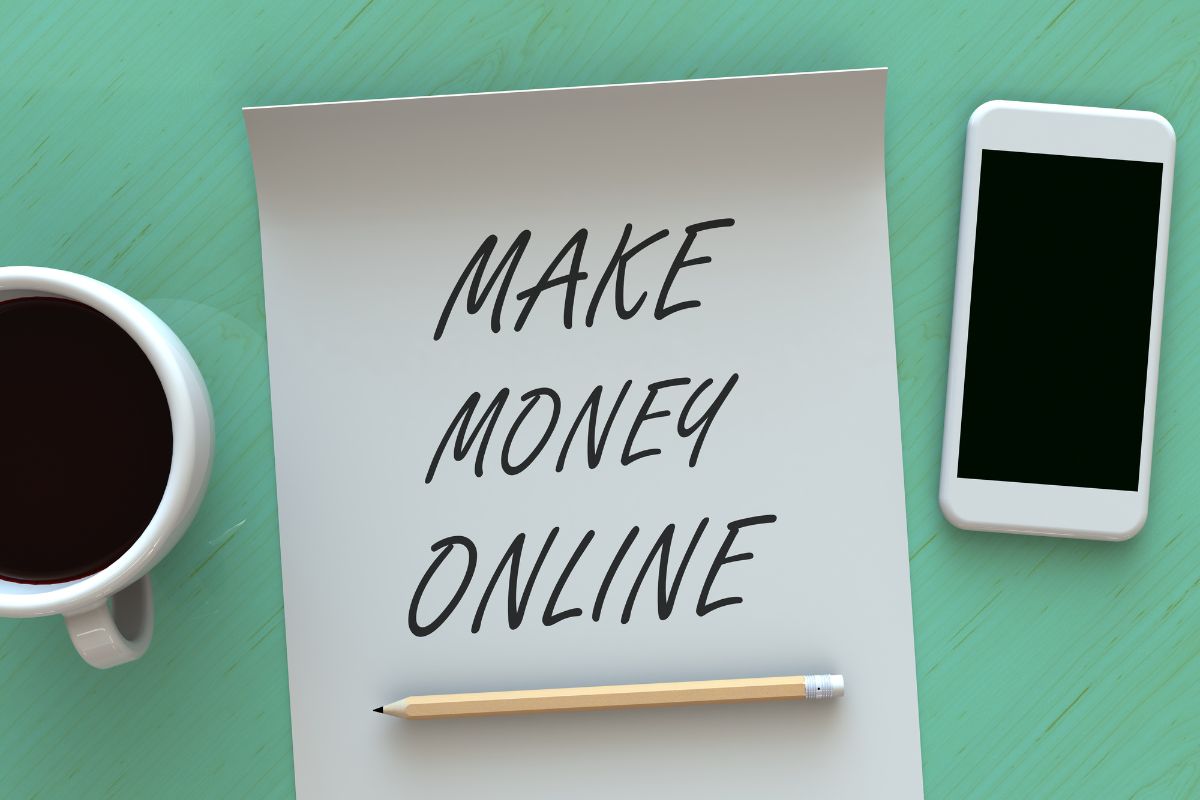 The picture tells about a coffee, a pen, a phone, and a piece of paper with notes indicating to find more ways to make money online for beginners that fit your skills and interests.