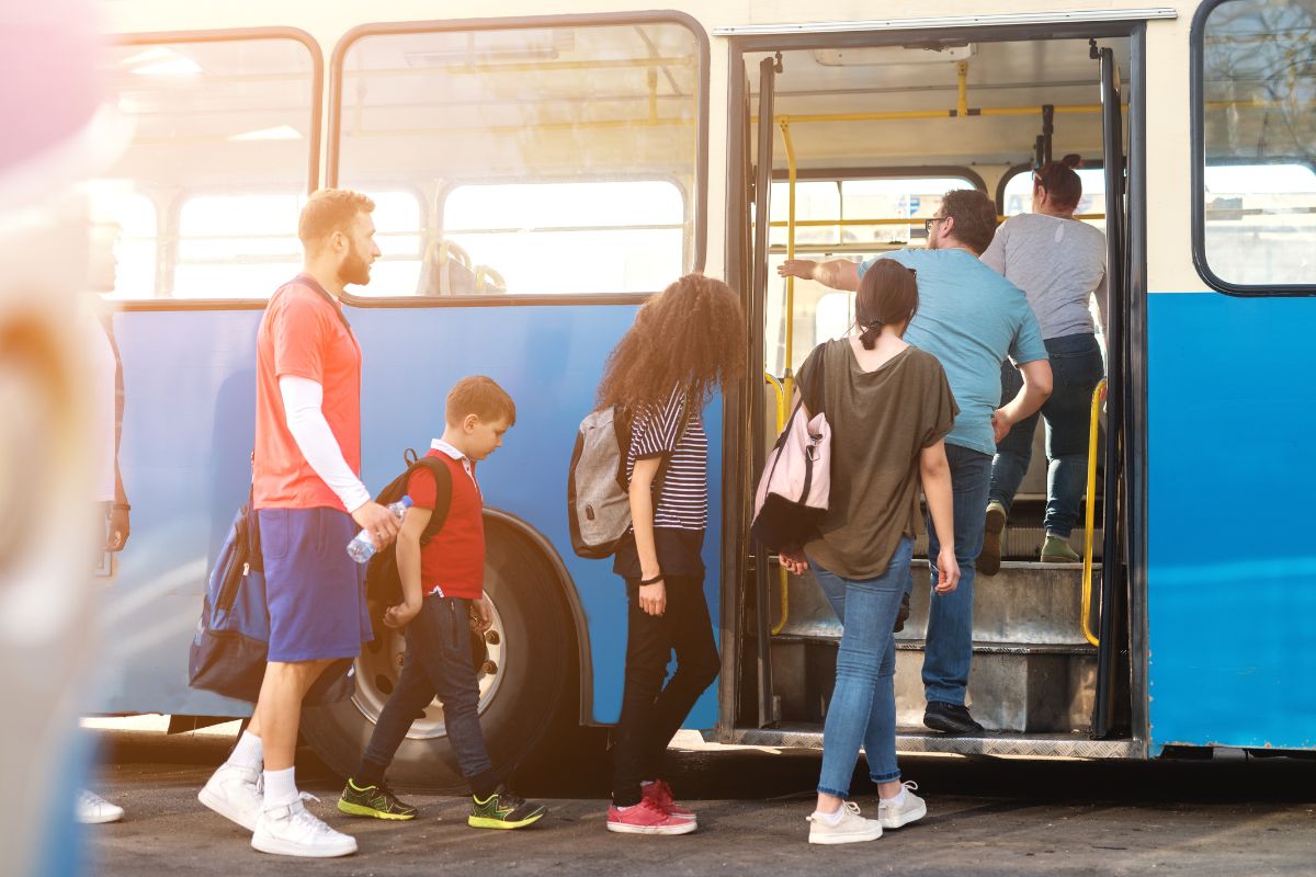 The photo tells about people getting on the bus which means transportation costs can add up fast, budgeting for car payments and maintenance keeps you from getting stuck with unexpected bills. 