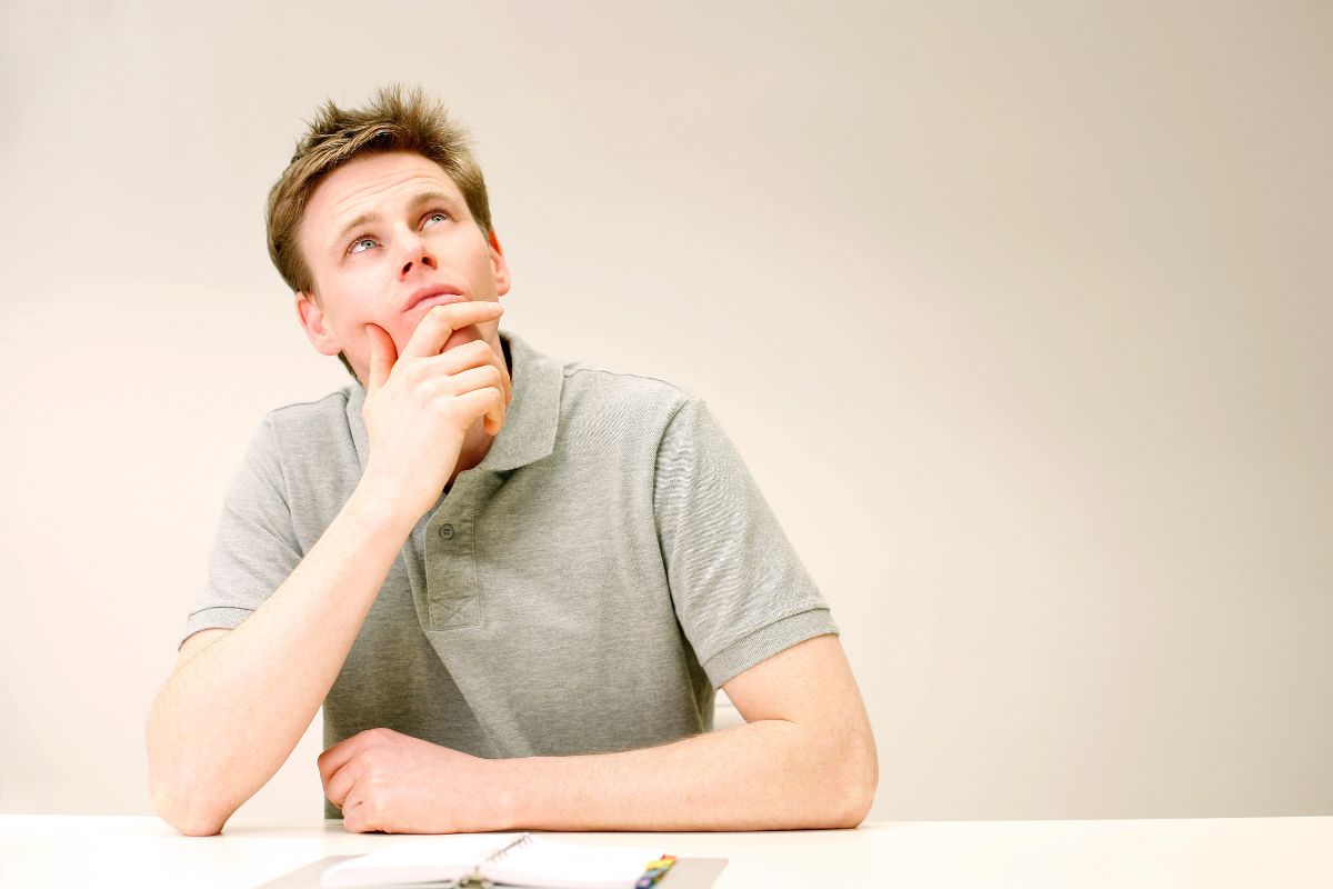 The image tells about a man thinking referring to asking yourself helps you focus on what's truly important.