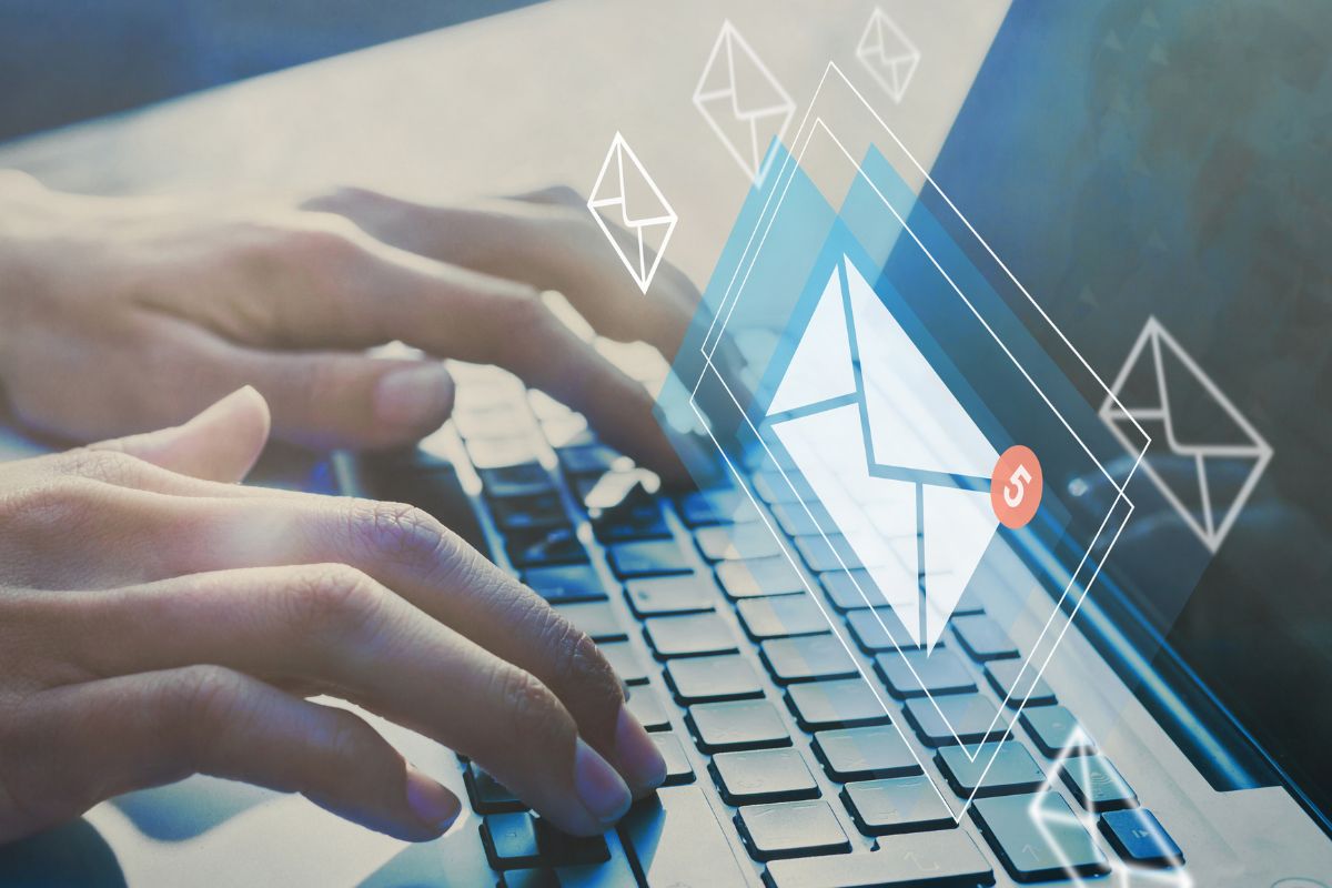 The photo shows a man's hand typing on the laptop with message icons referring to unsubscribing from marketing emails to keep more in your savings and make reaching goals easier.