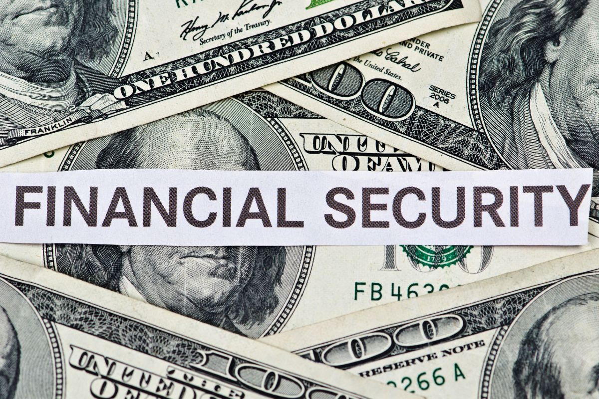 The picture shows money and paper with financial security wording.