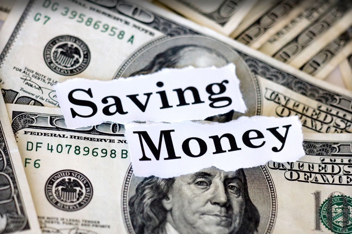 Image of money and papers with saving money wording.