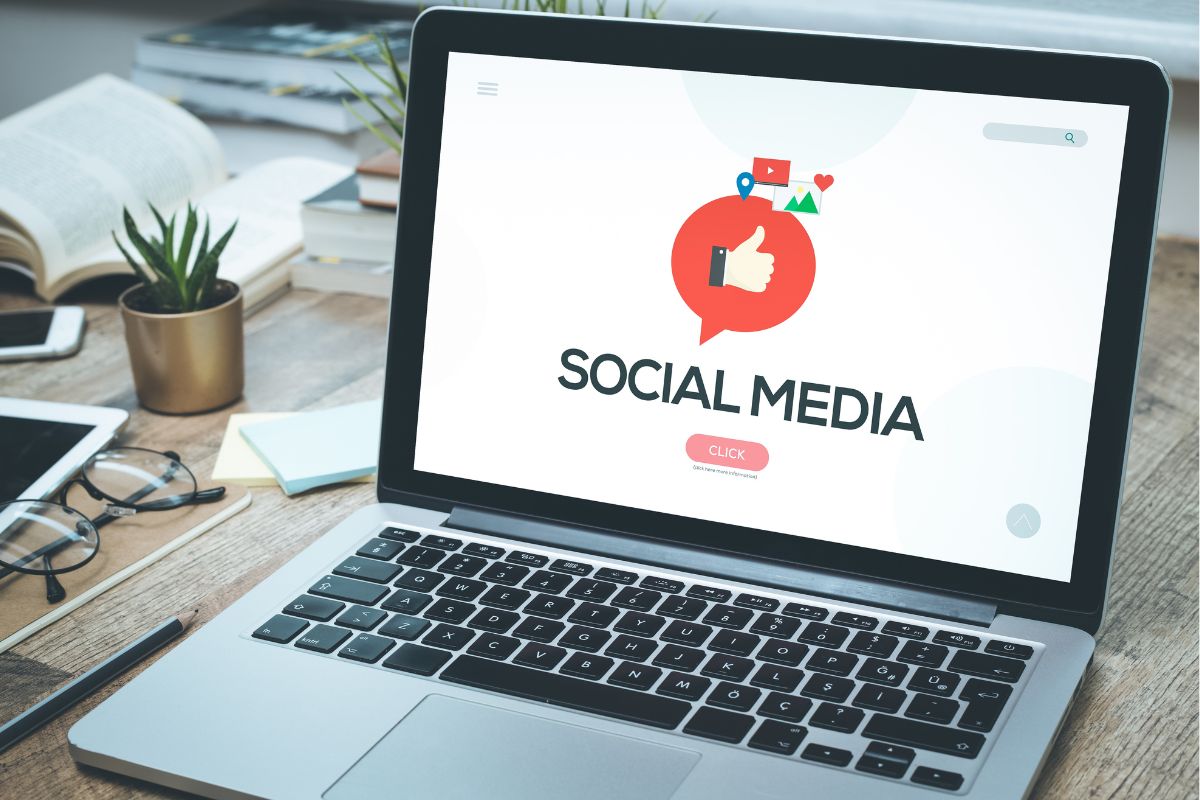 The picture shows a laptop with a social media display.