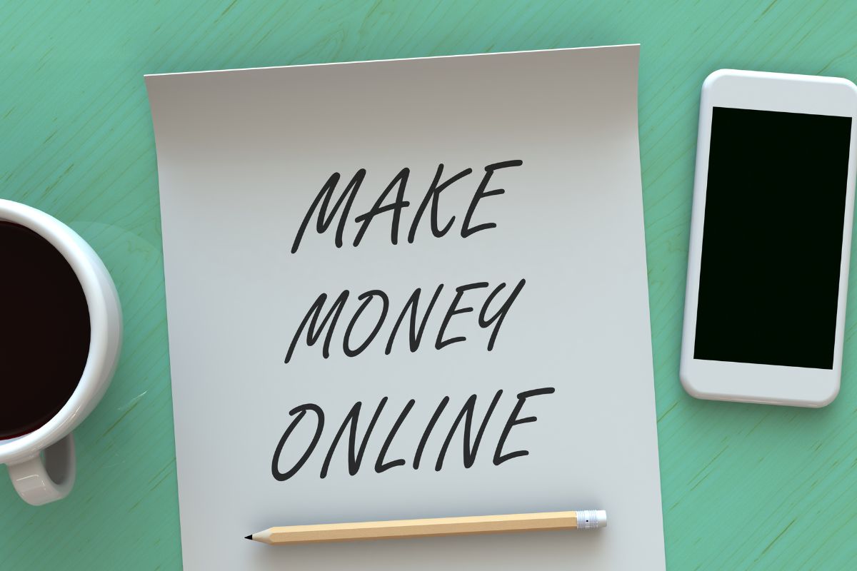 The picture shows a paper with make money online written.