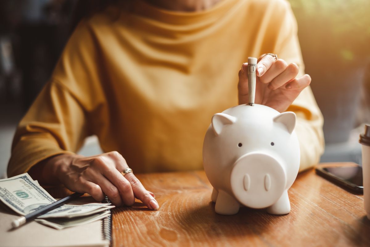 An image of a woman saving money.