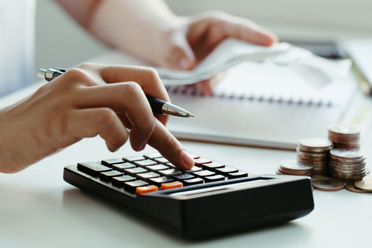 Image of a woman's hand budgeting.