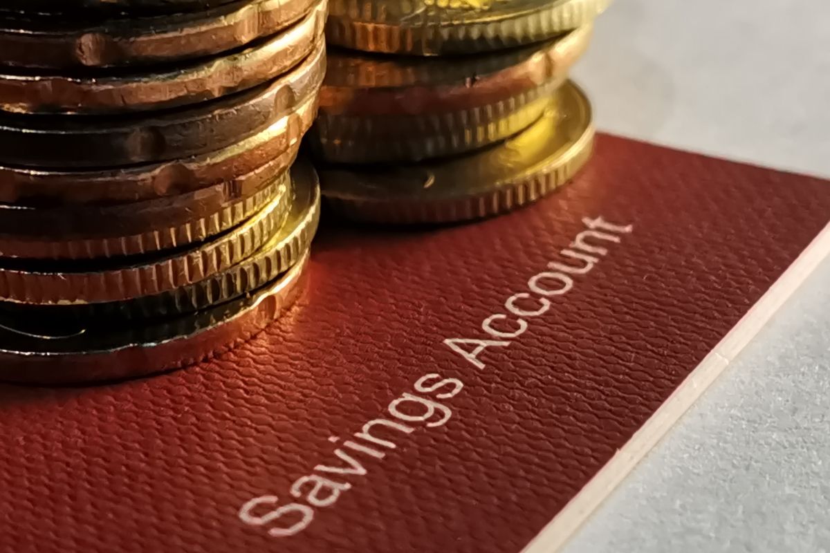 The image of coins and a savings account.