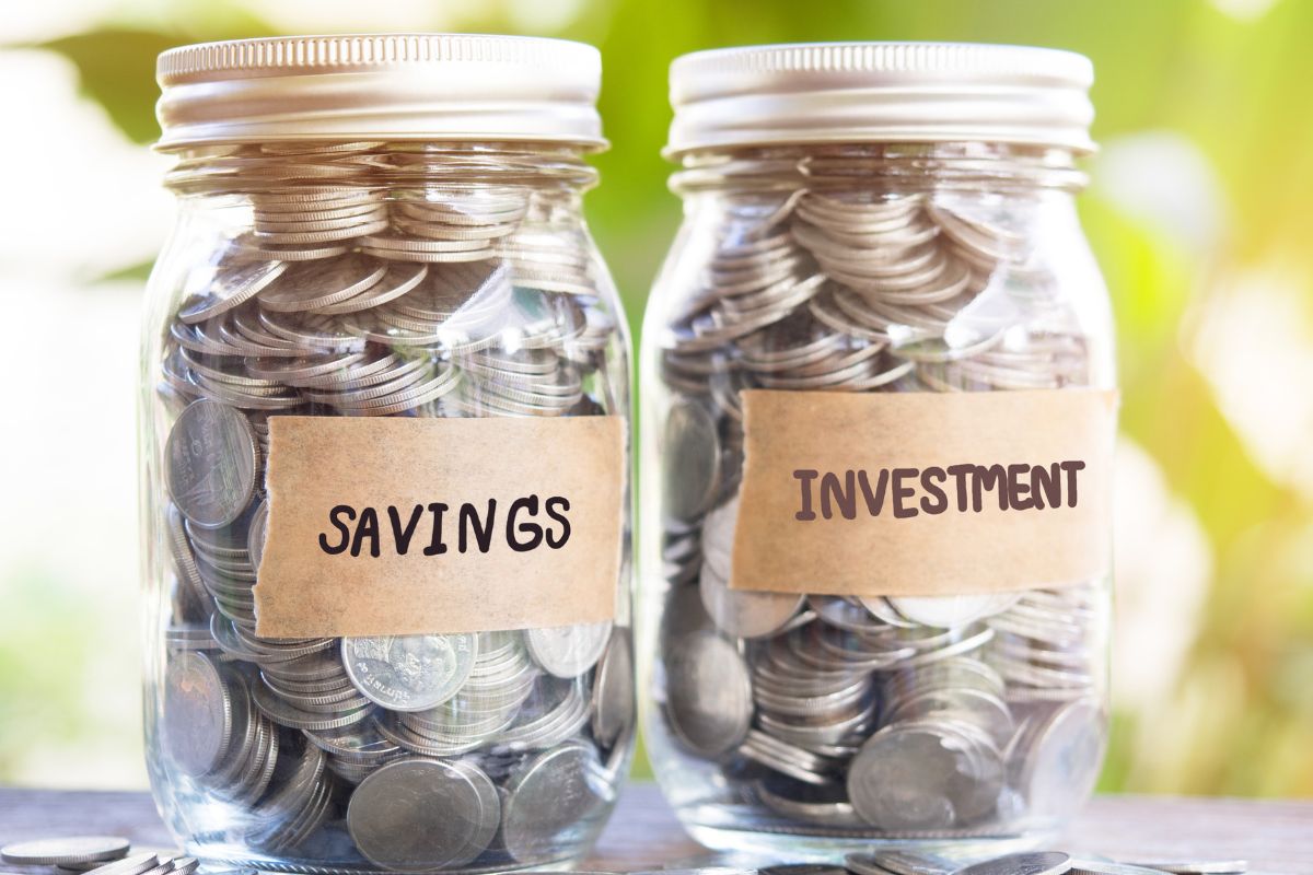 The picture shows jars with savings and investment coins.