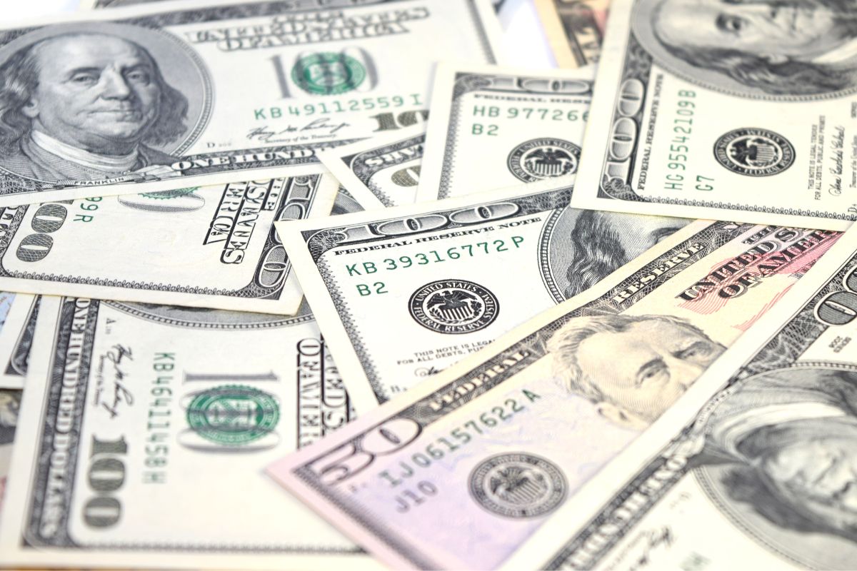 Photo shows dollar bills.
