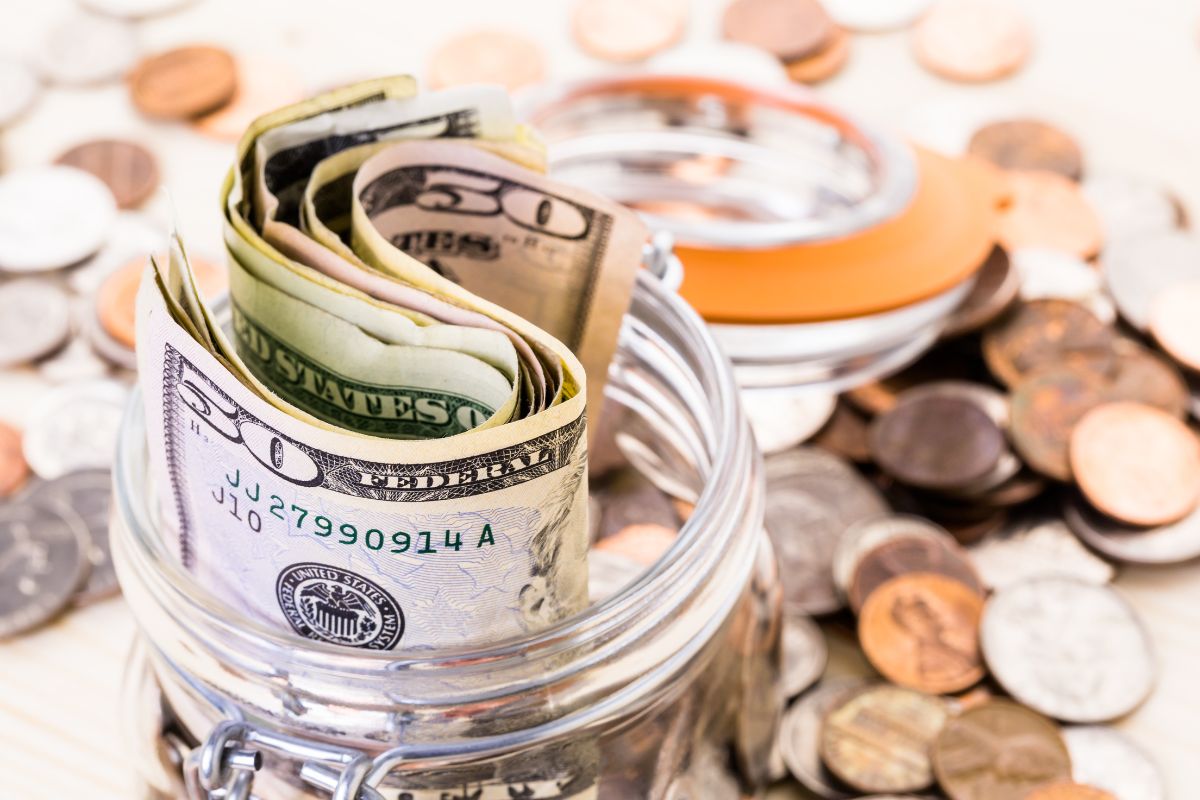 The picture of coins and a jar with money.