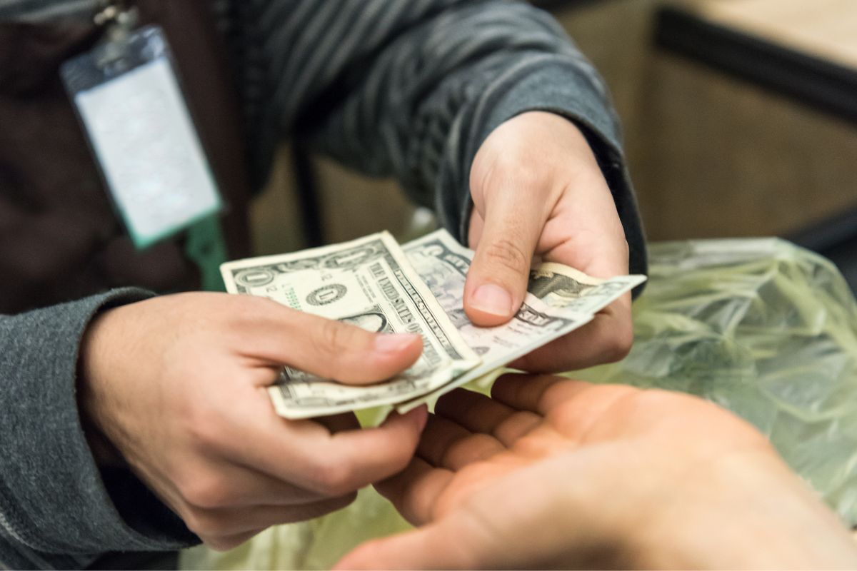 The picture of paying with cash.