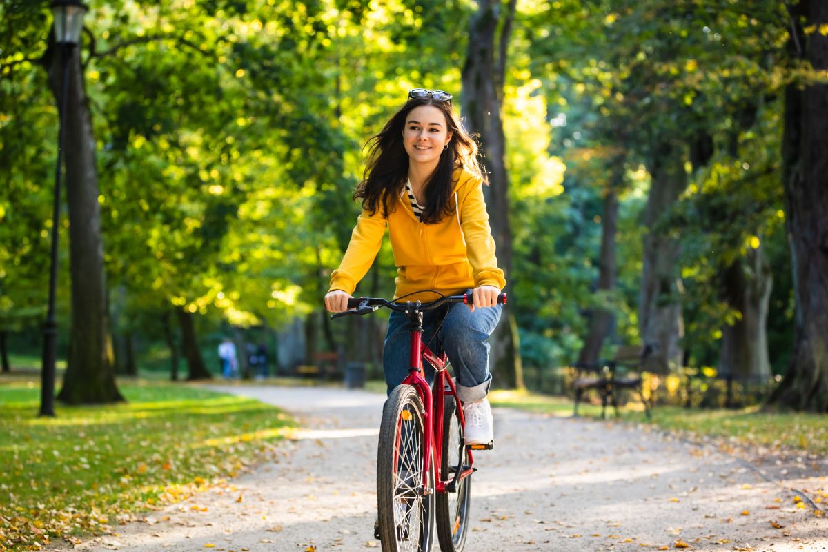 Image of a woman riding a bike.