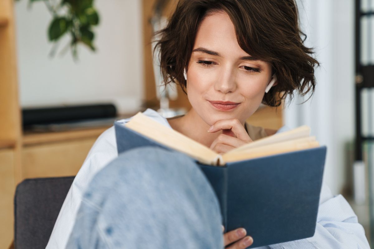 An image of a woman reading a book.