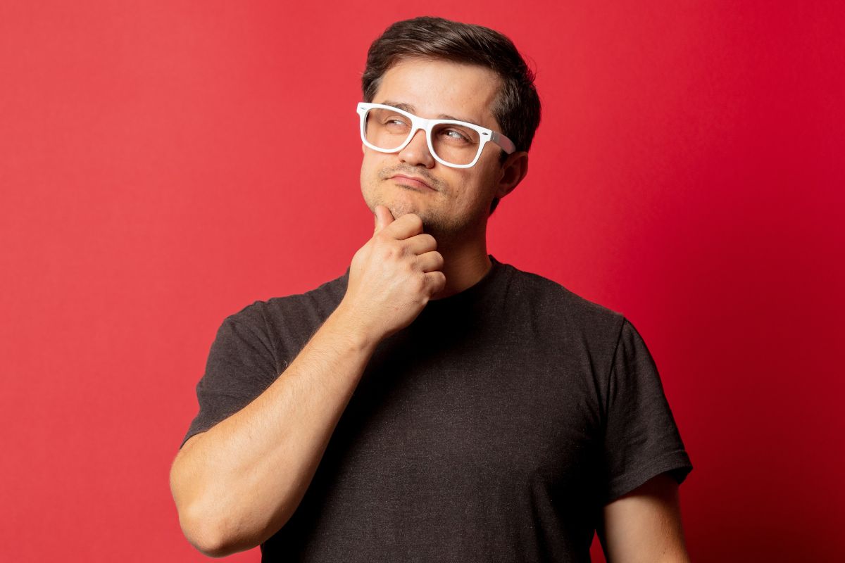 The image tells about a man wearing an eyeglass while thinking indicating that visualizing success daily makes it easier to take the right steps.