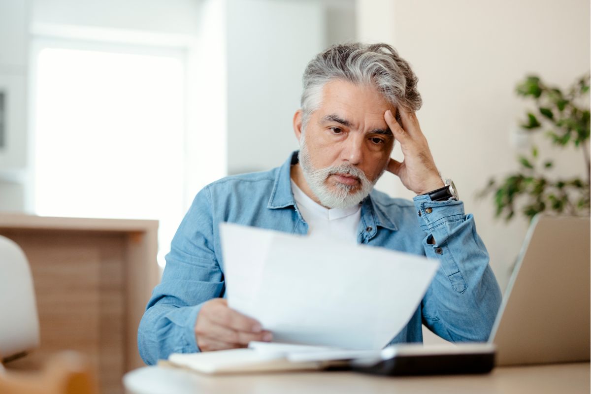The picture of a man worried about the paper.