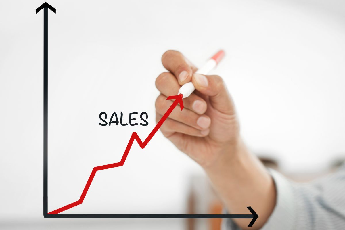 A photo of a woman's hand with high sales skills.