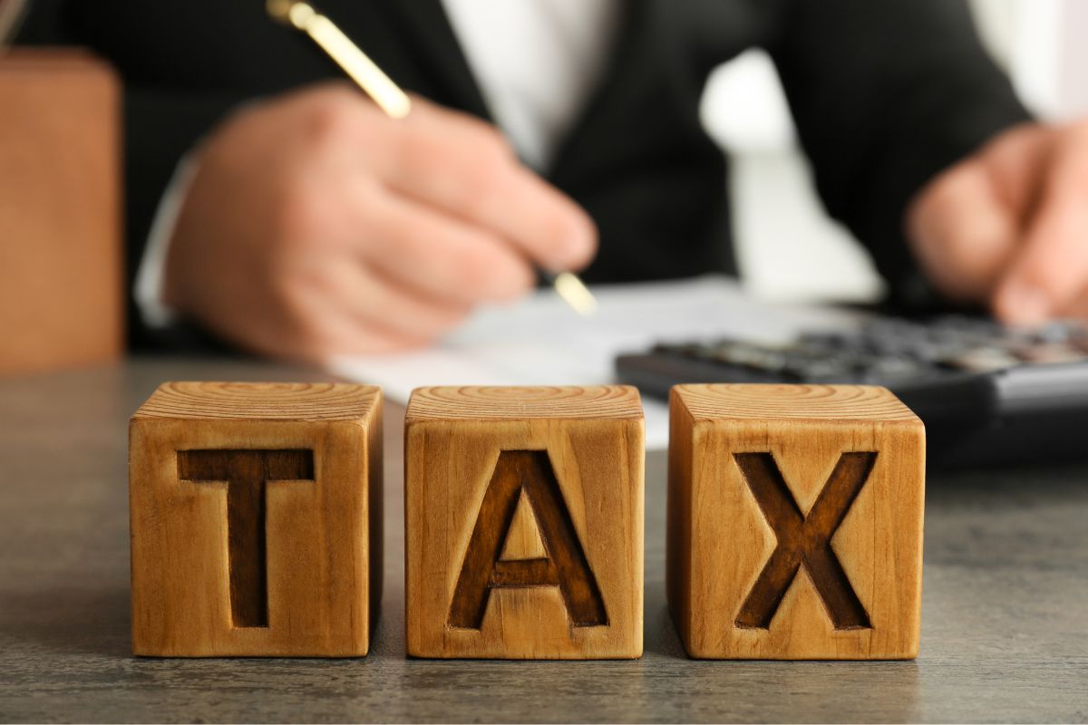 The photo shows a man learning tax strategies.