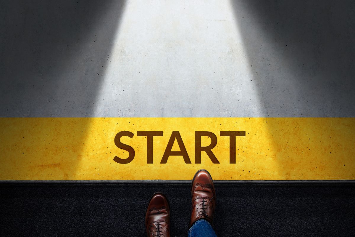 The image shows a man's foot stepping the yellow line with a note referring to taking steps to become a millionaire to see results and make a difference.