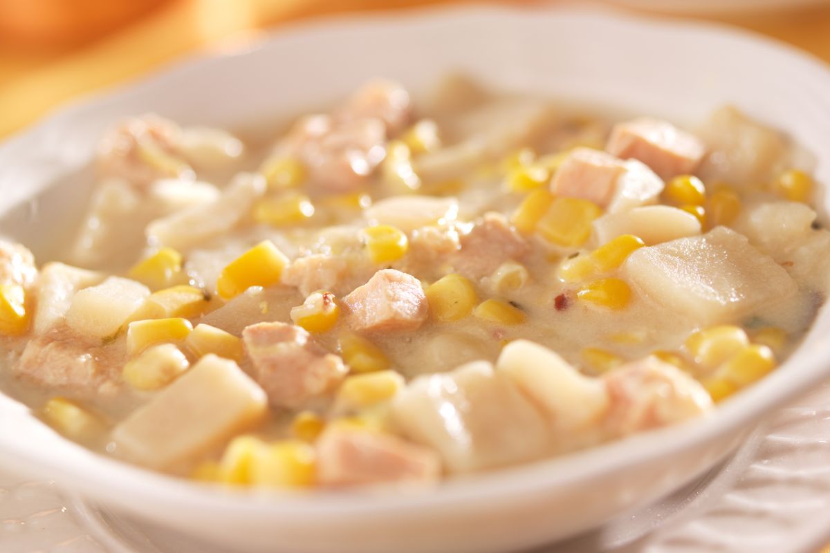 The photo shows a bowl with meats and corn referring to challenging yourself to make at least one new dish keeping meals from feeling boring and helping you learn to cook with what's available.