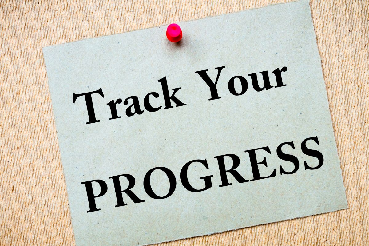 The picture of a paper with track your progress wording.