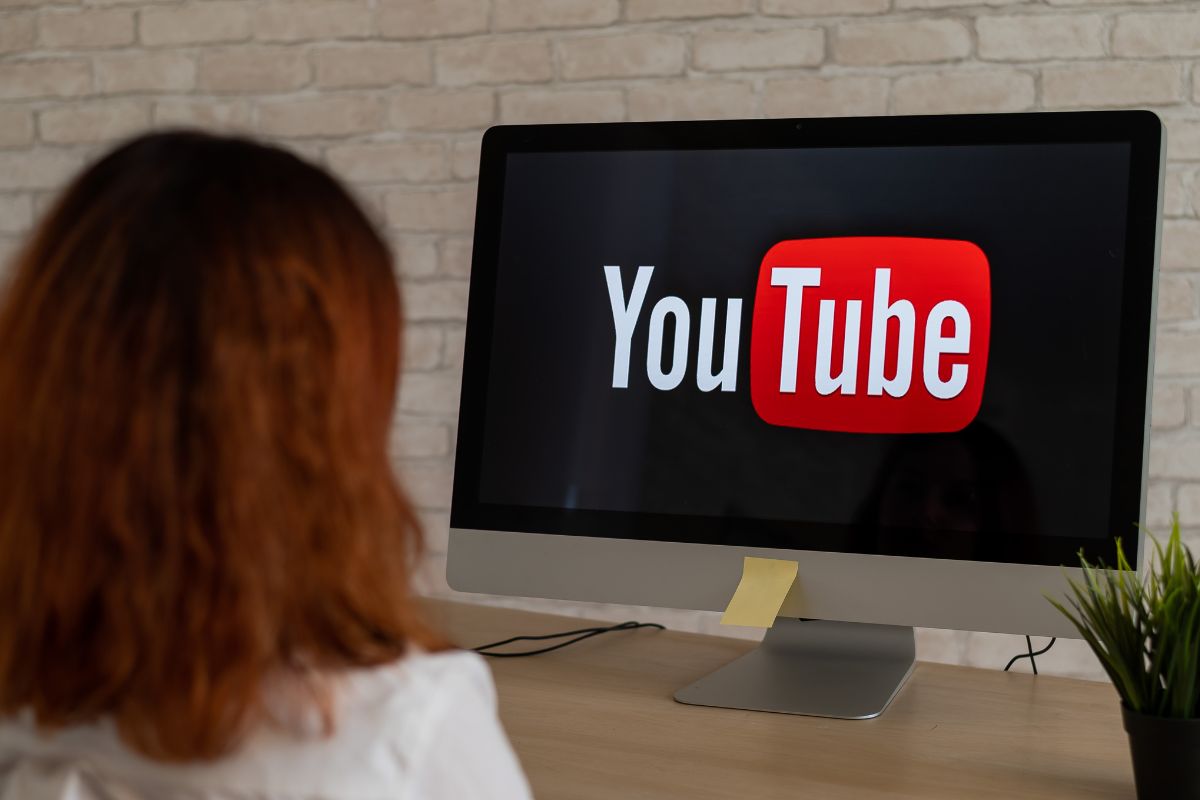 An image shows a woman monetizing on YouTube.